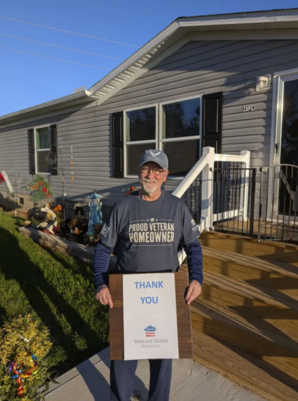 picture of Terry M. in front of a house
