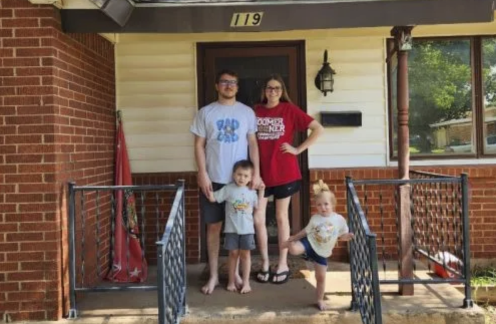 picture of Bradley O. in front of a house
